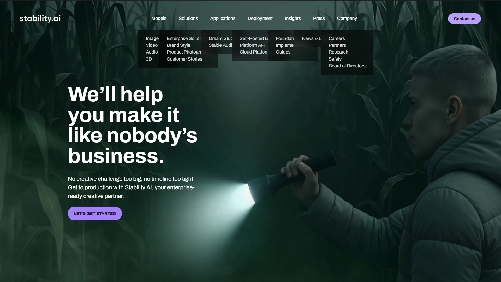 Stability AI dark green homepage with expanded mega menu and enterprise creative partner tagline